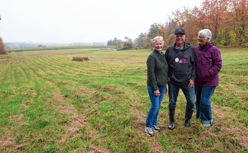 Cindy Palmer, chair of the Southampton Open Space Committee, stands with Ed and Mary Hamel, owners of Glendale Ridge Vineyard, on a portion of the 80 acres the Hamel's are placing in a conservation restriction.
