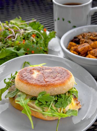 Share's signature “Egg Sammy” features a local egg fried to order topped with Cabot cheddar and local arugula.