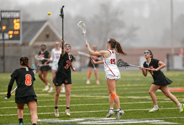 South Hadley’s Maddy McArdle (15) sends a pass downfield against Belchertown in the third quarter Thursday in South Hadley.
