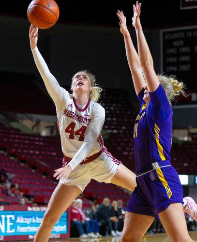 UMass guard Stefanie Kulesza (44) extends for a layup defended by Albany forward Helene Haegerstrand (14) in the fourth quarter Wednesday at the Mullins Center in Amherst.
