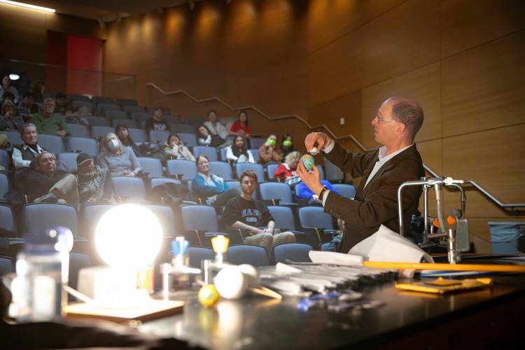 James Lowenthal, Mary Elizabeth Moses professor and Smith College chair of astronomy, delivers a public lecture “Chasing the Moon’s Shadow: The Total Solar Eclipse of April 8, 2024” last week at the UMass Integrated Sciences Building in Amherst.
