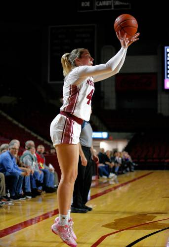 UMass guard Stefanie Kulesza (44) hits a three-point shot against UAlbany in the third quarter Wednesday at the Mullins Center in Amherst.