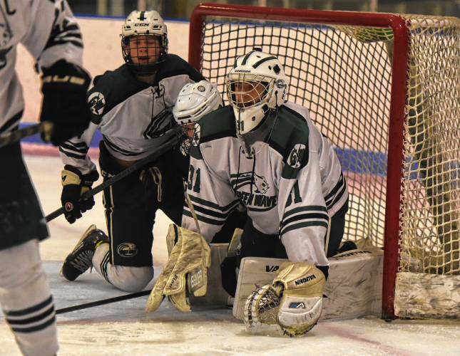 Greenfield goalie Cooper Smith (31) patrols the crease during a flurry of Amherst activity during the visiting Hurricanes’ 3-1 victory on Monday at Collins-Moylan Arena in Greenfield.