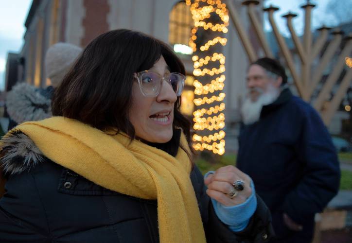 Tamar Helfen talks about the meaning of Hanukkah during an event celebrating the first day held in Northampton where community gathered to  light the first candles. 