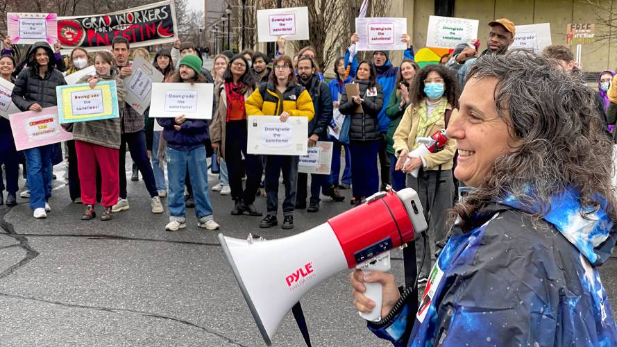 Rachel Weber, right, an instructor of social thought at UMass and the attorney representing students arrested during a sit-in protest in October over the war in Gaza, speaks at a rally in front of the school’s Whitmore Administration Building on Thursday. 