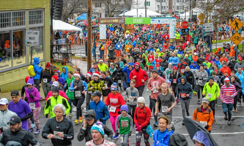 Runners start the 20th annual Hot Chocolate Run in Northampton on Sunday to raise money for Safe Passage’s mission to provide support and services to survivors of domestic violence.