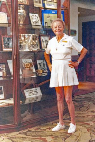 Marble admires a display case of her trophies and memorabilia at the International Tennis Hall of Fame in Newport, Rhode Island.