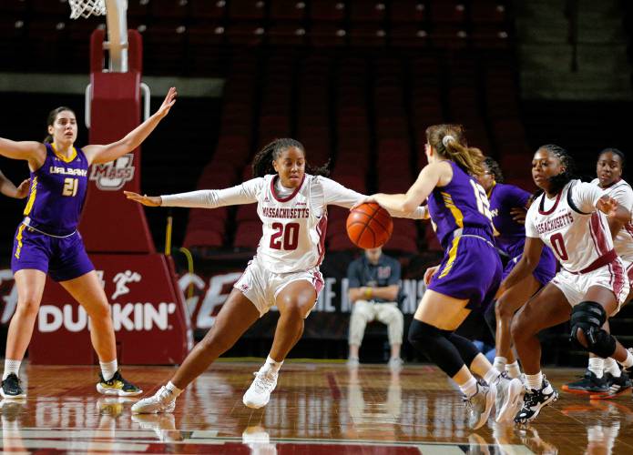 UMass forward Bre Bellamy (20) defends against UAlbany’s Sarah Karpell (13) in the fourth quarter Wednesday at the Mullins Center in Amherst.