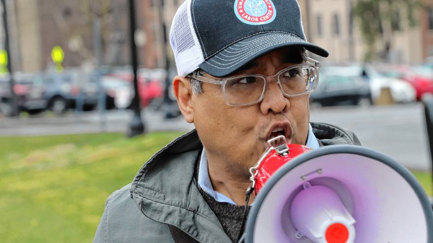 Cedric De Leon, a professor of sociology and labor studies at UMass Amherst, leads chants at a rally in front of the school’s Whitmore Administration Building on Thursday to call for the end of disciplinary actions taken against students who participated in a sit-in protest in October against the war in Gaza. 