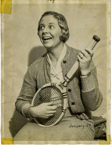 Marble at age 15 in early 1929, strumming her racquet like a guitar. She was musically gifted from a young age and sang professionally in her 20s.
