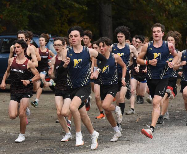 Northampton’s Teddy King-Pollet, center, leads the pack during a race against Amherst earlier this season. King-Pollet was selected as the Gazette’s Boys Cross Country Athlete of the Year.