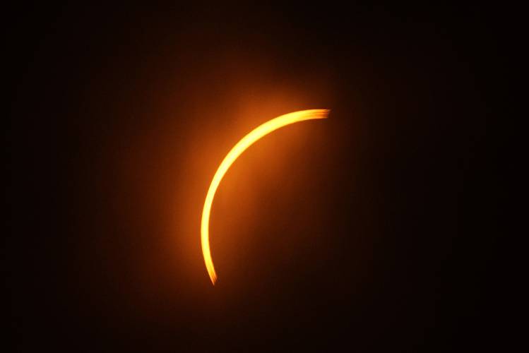 The moon partially covers the sun during a total solar eclipse, as seen from Eagle Pass, Texas, Monday.