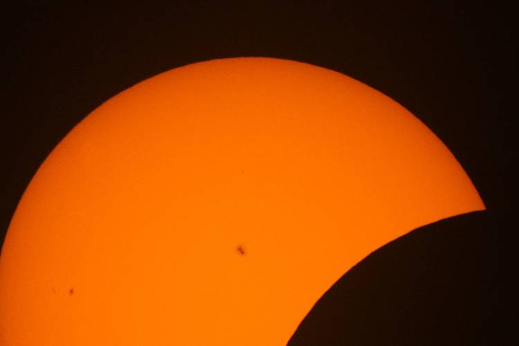 Sun spots are seen during the beginning phase of a total solar eclipse, Monday, April 8, 2024, in Arlington, Texas. (AP Photo/Julio Cortez)