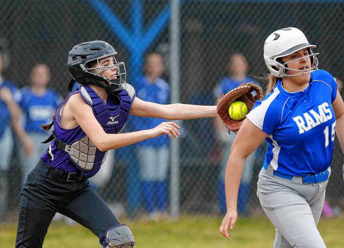 Smith Academy catcher Marissa Belina (12) tags out Granby baserunner Jordyn Placzek (15) after a dropped third strike in the bottom of the third inning Wednesday in Granby.