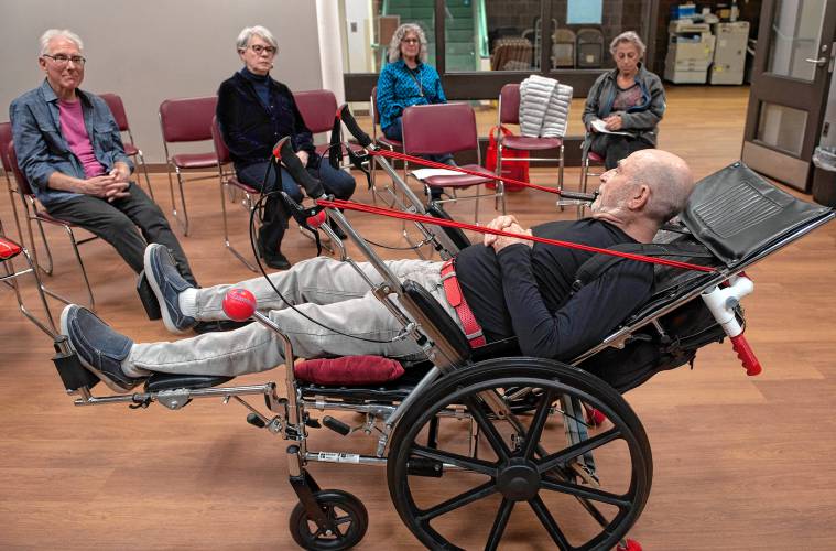 Marvin Glover demonstrates the prototype of the Realchair, a wheelchair he invented that allows for more user independence and comfort, at the second annual Amherst Senior Center Health Fair last week.  The mesh is a breathable material that works as a hammock allowing the person in the chair to have less stress on their body when sitting or in reclined position.