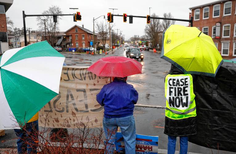 Around a dozen people gathered in the freezing rain Wednesday afternoon at the Nashawannuck Pond Boardwalk for a cease-fire standout just before the Easthampton City Council adopted a resolution calling for a cease-fire in Gaza.