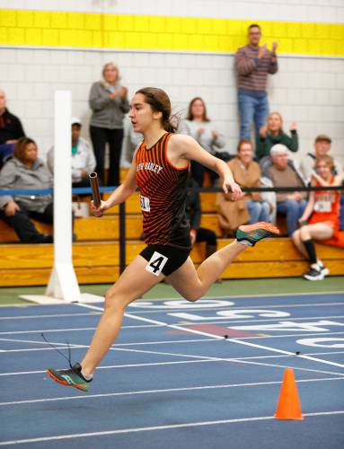 South Hadley’s Abigail Gelinas crosses the finish line for a second place finish in the girls 4x200 meter relay along with teammates Emma Levreault, Lauren Marjanski and Allison Fleury during the PVIAC indoor track meet Wednesday at Smith College in Northampton.