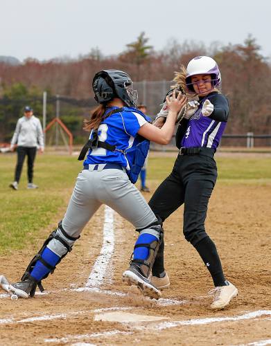 Granby catcher Scarlett LaRose (12) tags out Smith Academy baserunner Alexa Jagodzinski (4) at home plate in the top of the first inning Wednesday in Granby.