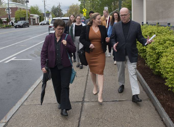 Gabrielle Gould, the executive director of the Amherst Business Improvement District, takes Rep.  Mindy Domb, left,  and Congressman James McGovern, right,  on a tour of businesses in Amherst on Wednesday, May 3, 2023. 