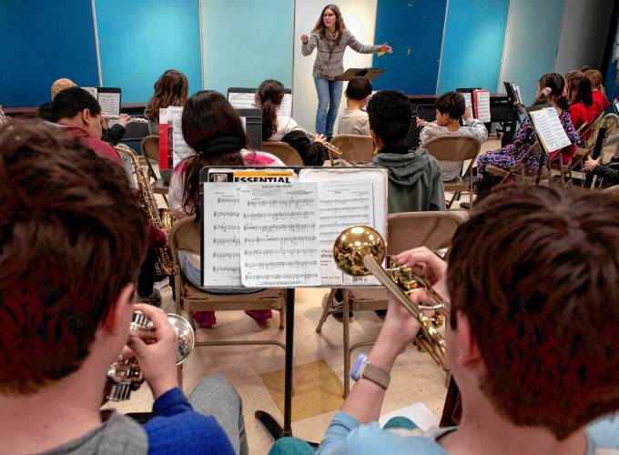Ariel Templeton, a music teacher for the Amherst Elementary Schools, teaches band at Wild Wood on Wednesday afternoon. 