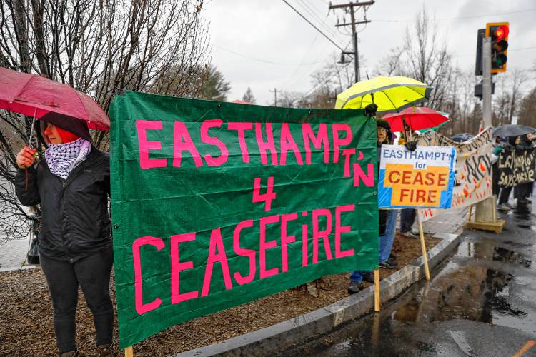 Around a dozen people gathered in the freezing rain Wednesday afternoon at the Nashawannuck Pond Boardwalk for a cease-fire standout just before the Easthampton City Council adopted a resolution calling for a cease-fire in Gaza as the war approaches the six-month mark. 