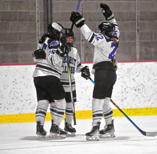Amherst College celebrates Maeve Reynolds’ go-ahead goal in the third period during the Mammoths’ 4-2 win over Western New England on Tuesday night at Orr Rink.