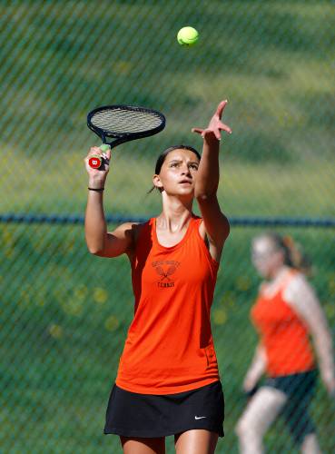 South Hadley’s Yanna Stefoglo serves against Belchertown’s Amanda Murray during their No. 2 singles match Thursday at Mount Holyoke College.