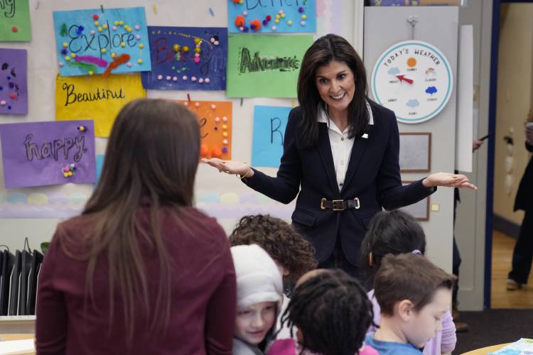Republican presidential candidate former UN Ambassador Nikki Haley talks with students during a campaign stop at the Polaris Charter School in Manchester on Friday.