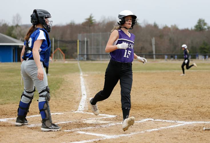 Smith Academy baserunner Caitlin Graves (15) crosses home plate to score against Granby in the top of the first inning Wednesday in Granby.