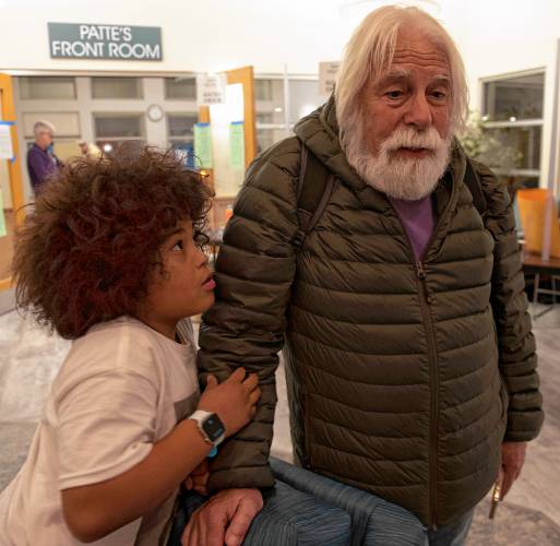 Barry Goldstein talks about the Northampton election while his grandson, Azai Dugger, listens at the Northampton Senior Center Tuesday evening.