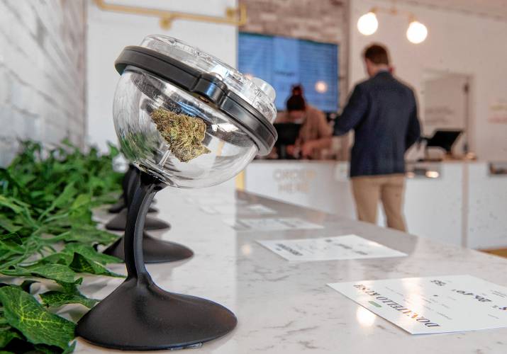 Marijuana is displayed on the “bud bar” at Balagan Cannabis during the Northampton dispensary’s first day  in 2021.