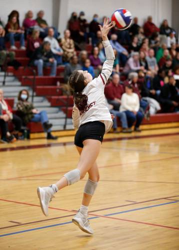 Amherst’s Liza Beigel (1) serves in the fourth set against Holliston during the MIAA Division 3 quarterfinal  in Amherst.