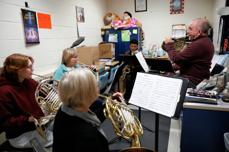 Ira Brezinsky, right, and fellow Bombyx Brass Collective members Jody Kinner and Shelly Brezinsky practice with South Hadley High School band students Vivien Prince, Jacob Saenz and Rowan McCarthy while visiting the class Tuesday morning at the high school.