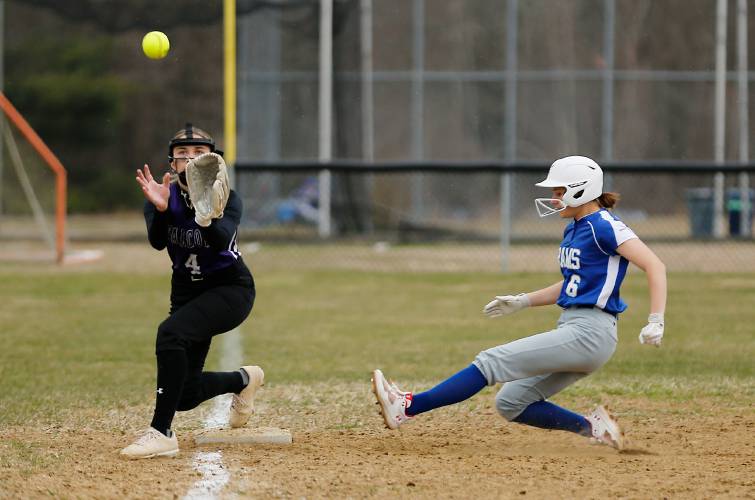 Granby baserunner Cassie Flaherty (6) safely steals third base ahead of the tag from Smith Academy’s Alexa Jagodzinski (4) in the bottom of the first inning Wednesday in Granby.