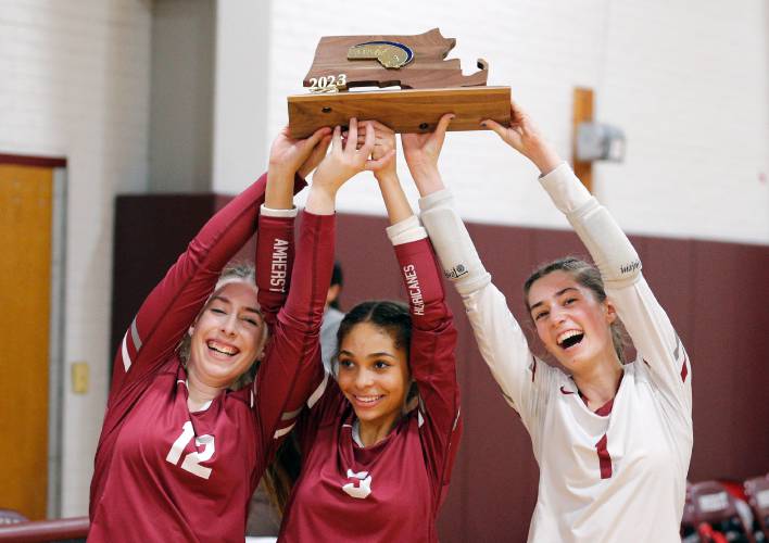 Amherst captains Emerson Joyce, from left, Talia Sadiq and Liza Beigel receive the MIAA Division 3 Final Four plaque after defeating Holliston in Amherst.