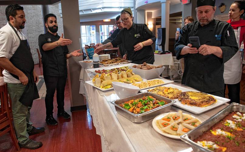 Mohamed Alqamoussi, the culinary specialist with the National Humane Society, introduces the dishes made during a training with chefs with residential dining at Smith College on plant-based breakfast foods.