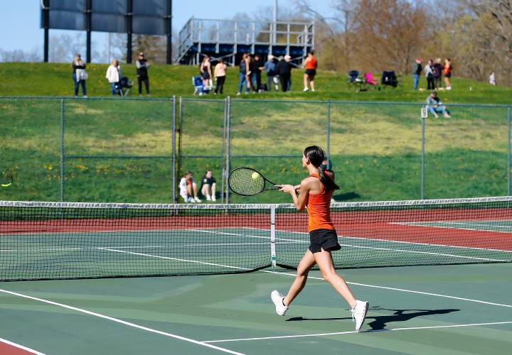 South Hadley’s Yanna Stefoglo volleys against Belchertown’s Amanda Murray during their No. 2 singles match Thursday at Mount Holyoke College.