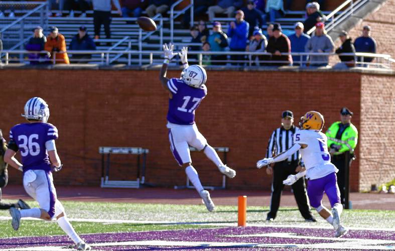 Amherst College’s Christian Moore (17) intercepts a fourth-quarter pass to seal a 21-14 win over Williams on Saturday at Pratt Field in Amherst.