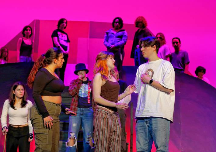 Max Hartley, from right, Clementine Mulcahy, and Eden Kates rehearse with other cast members of Northampton High School’s production of “Freaky Friday” on in the high school auditorium.