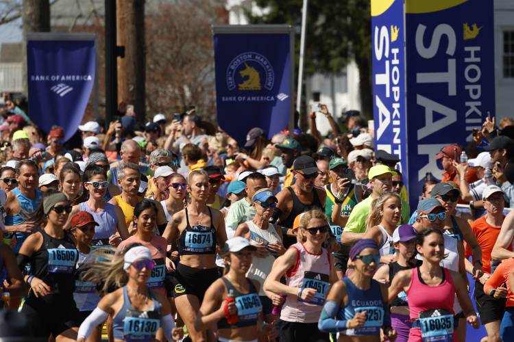 A wave of runners start the Boston Marathon, Monday,  in Hopkinton.