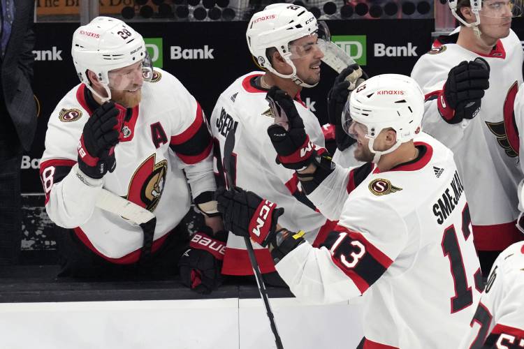 Ottawa Senators left wing Jiri Smejkal (13) is congratulated for his goal against the Boston Bruins during the second period of an NHL hockey game Tuesday, April 16, 2024, in Boston. (AP Photo/Charles Krupa)
