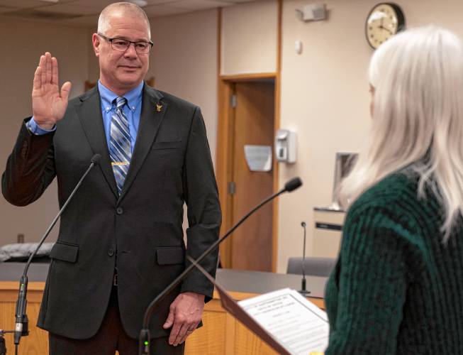 Jason Tirrell gets sworn in as an At-Large City Councilor in Easthampton by Barbara LaBombard, the Easthampton City Clerk. 