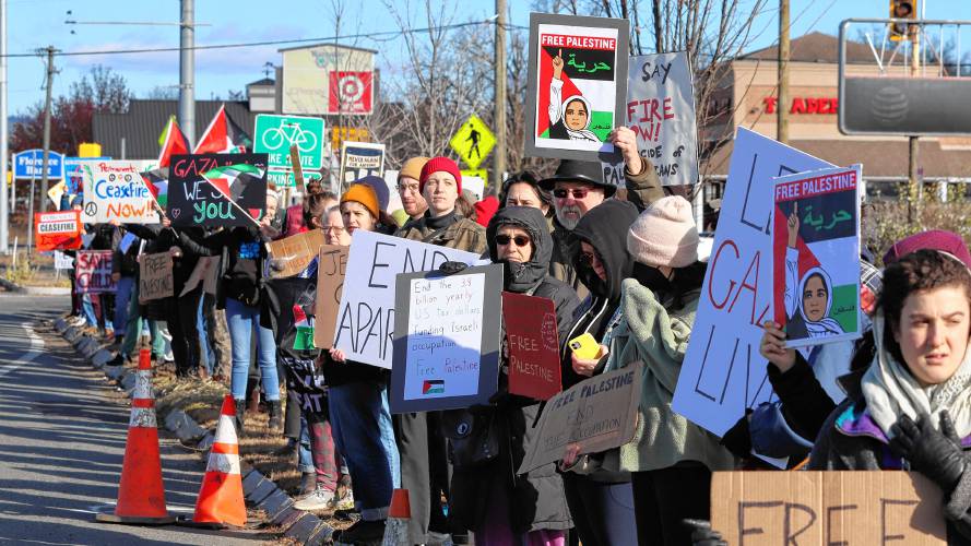 A group of protestors with the organization Jewish Voice for Peace stand along Route 9 in Hadley on Friday, demonstrating against the ongoing war in Gaza.  