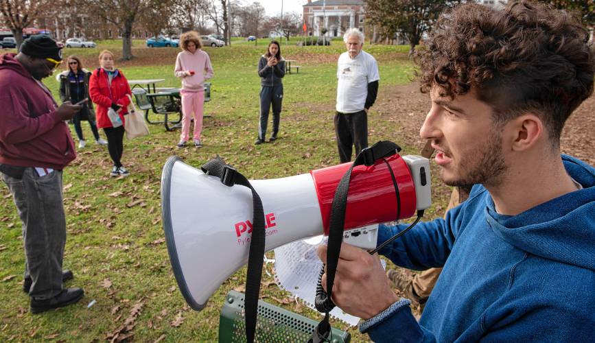 Liam Rue, a UMass junior, speaks at a recent rally on the Amherst Common in support of proposed legislation that would impose a 2.5% tax on Massachusetts private college endowments over $1 billion.  