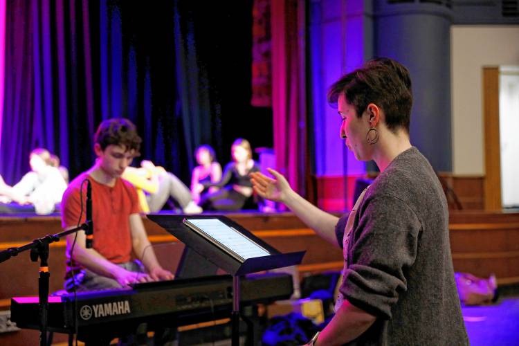 Musical director Susan Dillard, right, and accompanist Noah Daube-Valois work with the cast for Northampton High School’s production of 