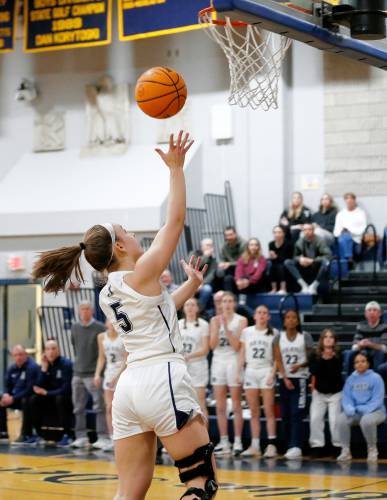 Northampton’s Bri Heafey (5) puts in a breakaway layup against Mansfield in the third quarter of the MIAA Division 2 girls basketball round of 16 game Tuesday night in Northampton.