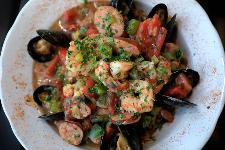 The seafood jambalaya dish with mussels, shrimp, crawfish, andouille sausage, trinity and tomato simmered with Acadian spices and Carolina rice at Gombo Nola Kitchen & Oyster Bar on Main Street in Northampton.