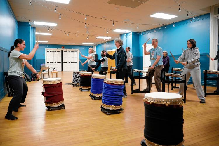 Mountain River Taiko artistic director Miho Connolly, left, leads a Try Taiko class on the Japanese drums in the Peacock Room at Bombyx. The Florence arts center has added new events in the past several months, including film, theater, and dance, in addition to its live music lineup.