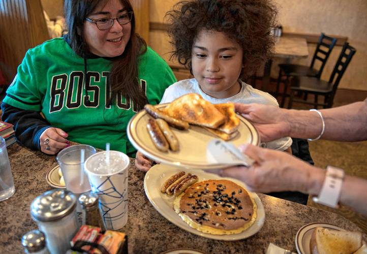 Azai Dugger at the Bluebonnet Diner, with his mother, Rosie Goldstein. “I order a lot of stuff here at once,” Duggar says. “The Bluebonnet has great chocolate milk, the best in town.”
