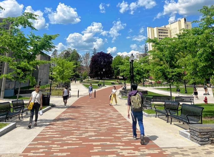 Students walk through the University of Massachusetts Amherst campus.